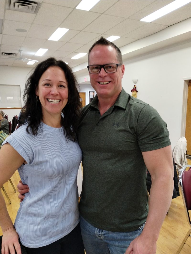 John Antle and his wife Brandy smiling together in Olds, Alberta